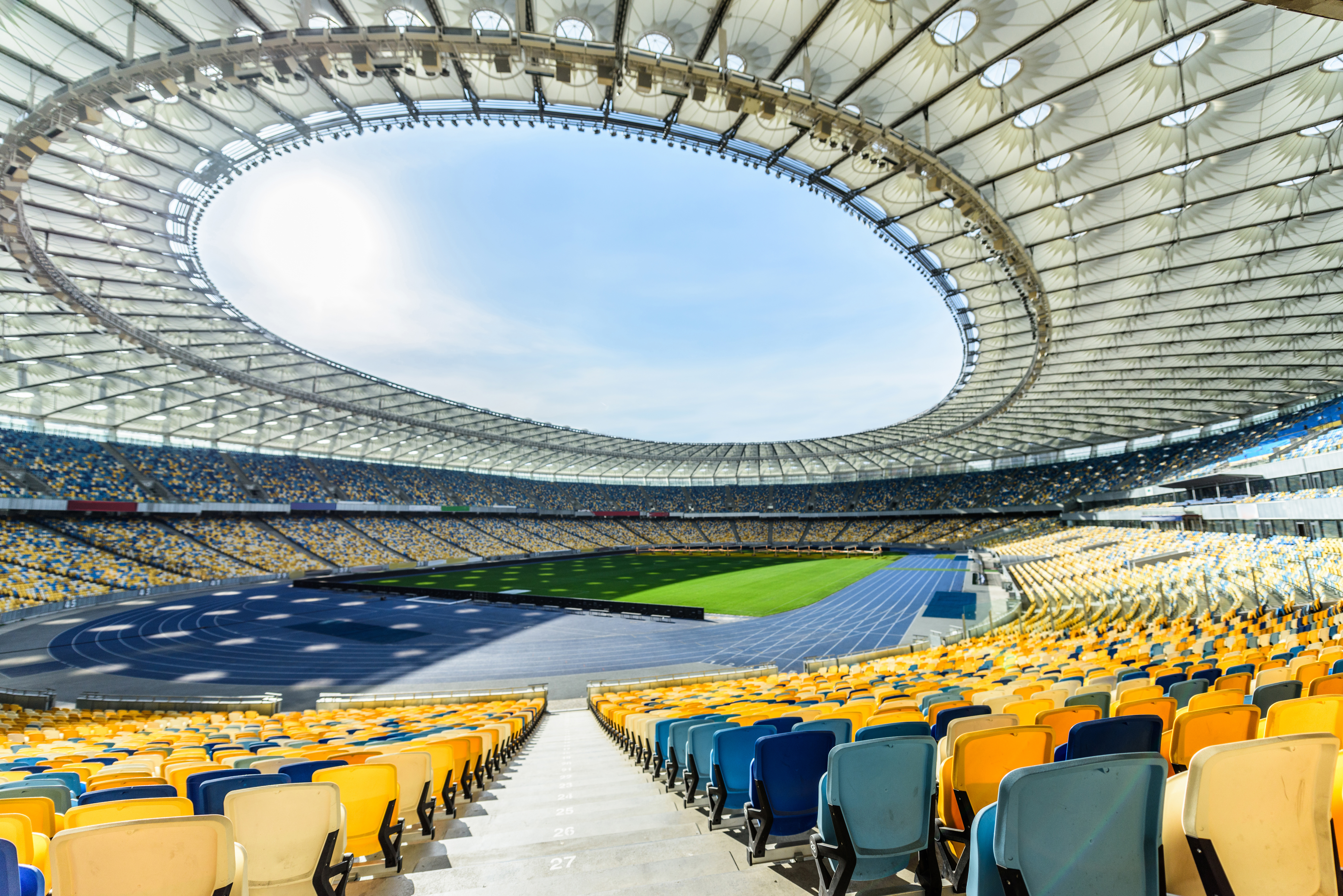 Rows of yellow and blue stadium seats on soccer fi 2021 04 05 09 40 17 utc